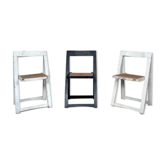 Trio of vintage folding chairs with canning and solid wood