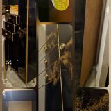 Black and gold lacquered Sanibloc furniture in the style of Maison Jansen, 1970