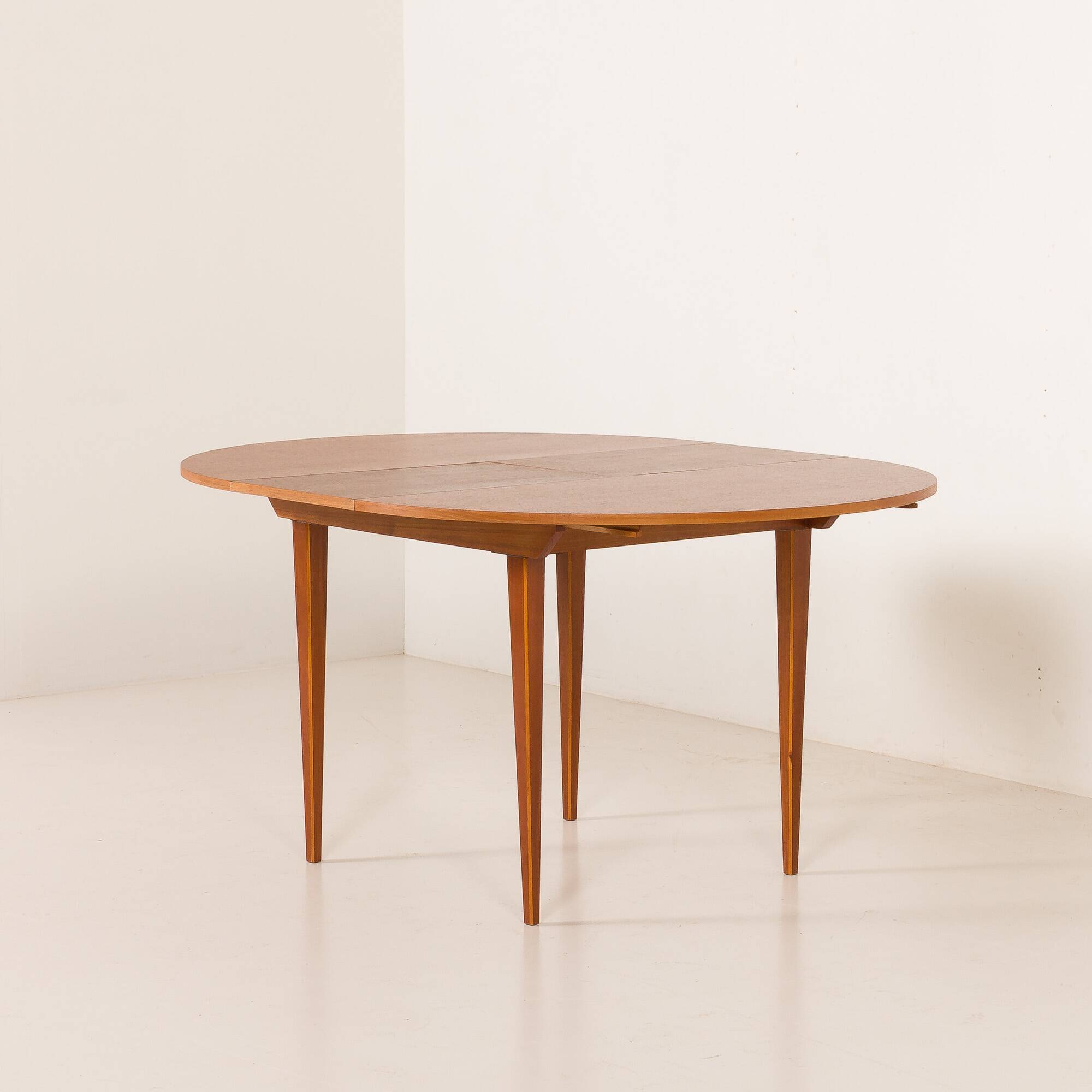 Scandinavian round teak table with hidden extension, 1970s
