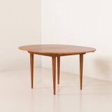 Scandinavian round teak table with hidden extension, 1970s