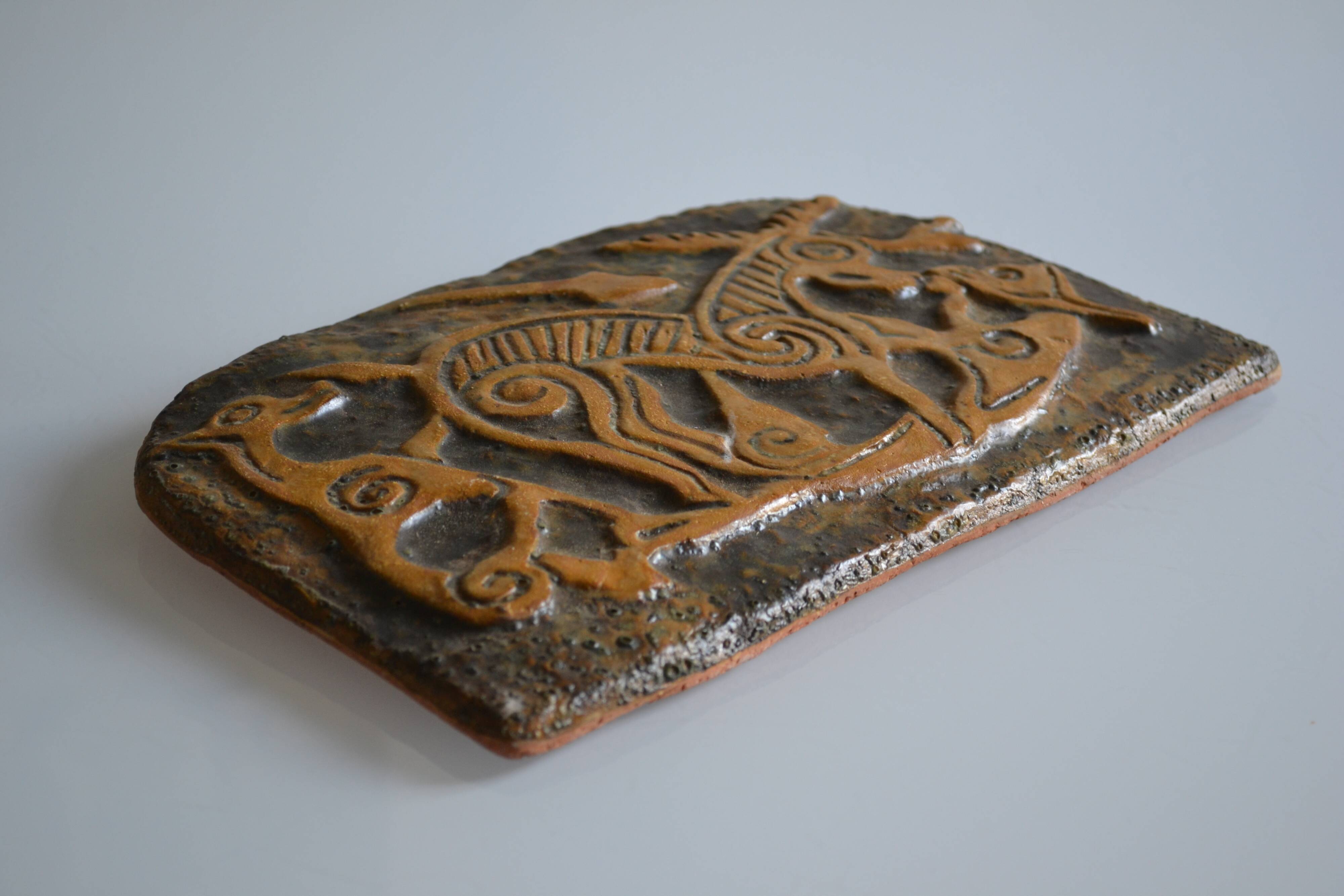 Bas-relief sculpture in terracotta inspired by the Celtic bestiary