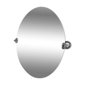 Vintage beveled oval mirror 70s with its silver colored metal wall hangers
