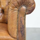 Fauteuil chesterfield sur roulettes en cuir de mouton