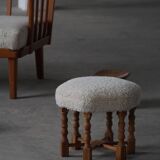 Pair of mid-century Danish oak stools with shearling lambswool upholstery, 1950s.