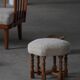 Pair of mid-century Danish oak stools with shearling lambswool upholstery, 1950s.