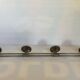Chromed metal coat rack with four hooks