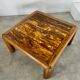 Old coffee table with golden marble top, 70s design, vintage wooden feet