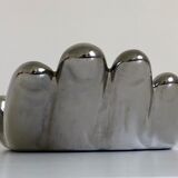 Empty silver chromed ceramic pocket in the shape of a large hand, 1980