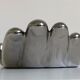 Empty silver chromed ceramic pocket in the shape of a large hand, 1980