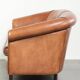 Sheepskin 2-seater sofa with a warm cognac brown colour scheme