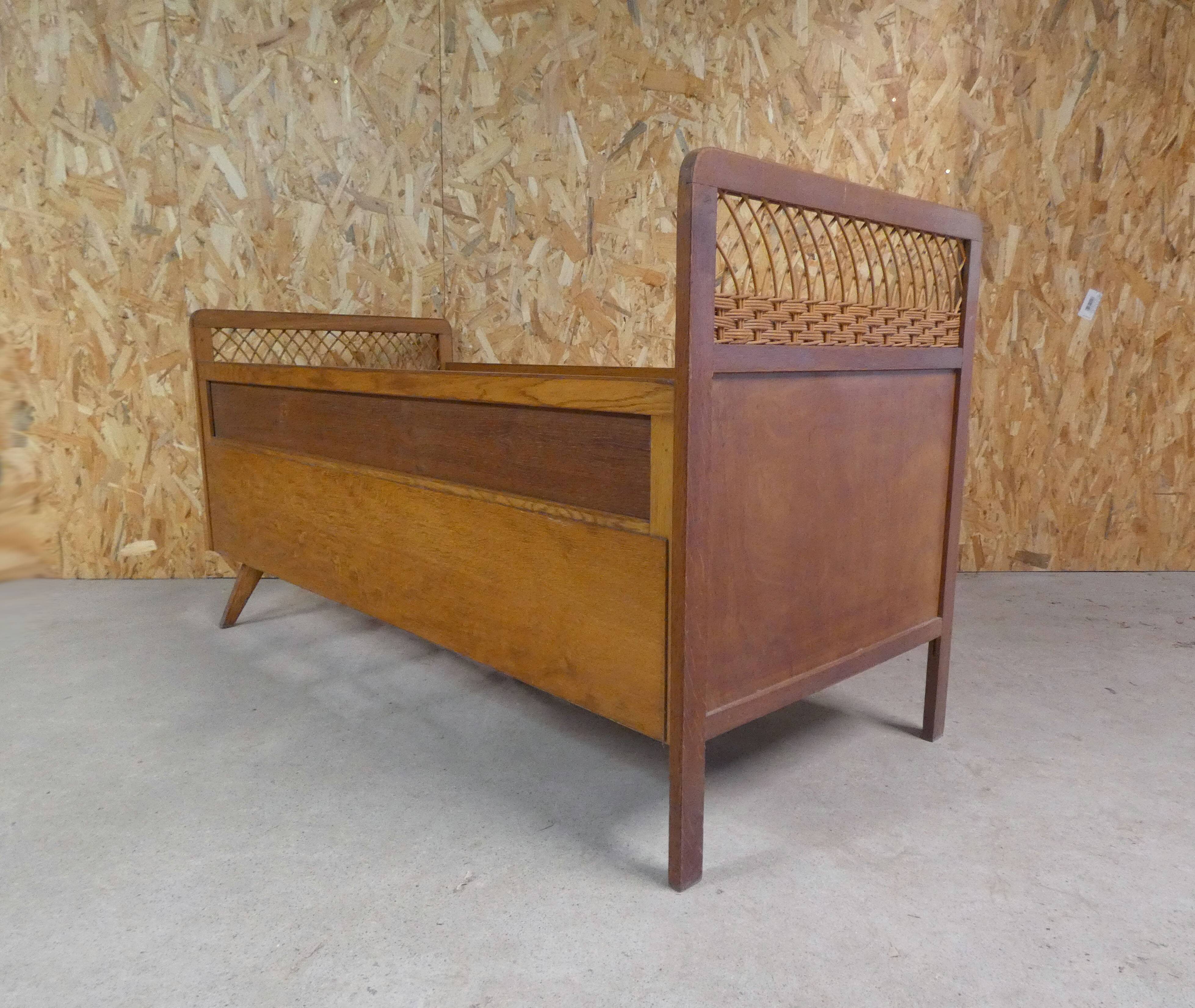 Vintage rattan and wood bed for children's compass feet
