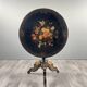 Napoleon III guéridon table in black lacquered wood with floral painted decoration, 19th century.