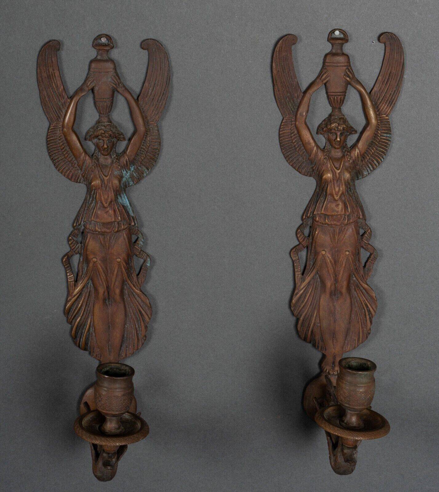 Pair of Empire period bronze sconces decorated with a winged woman
