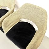 Series of six swivel chairs with an organic shell, patterned fabric and base.