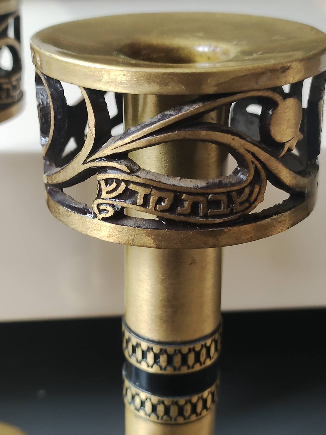 Pair of Hebrew Candlesticks. In antique gold-plated brass. Signed FFS Israel