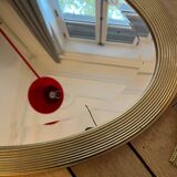 Antique oval beveled mirror adorned with tassels