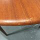 Round scandinavian teak table