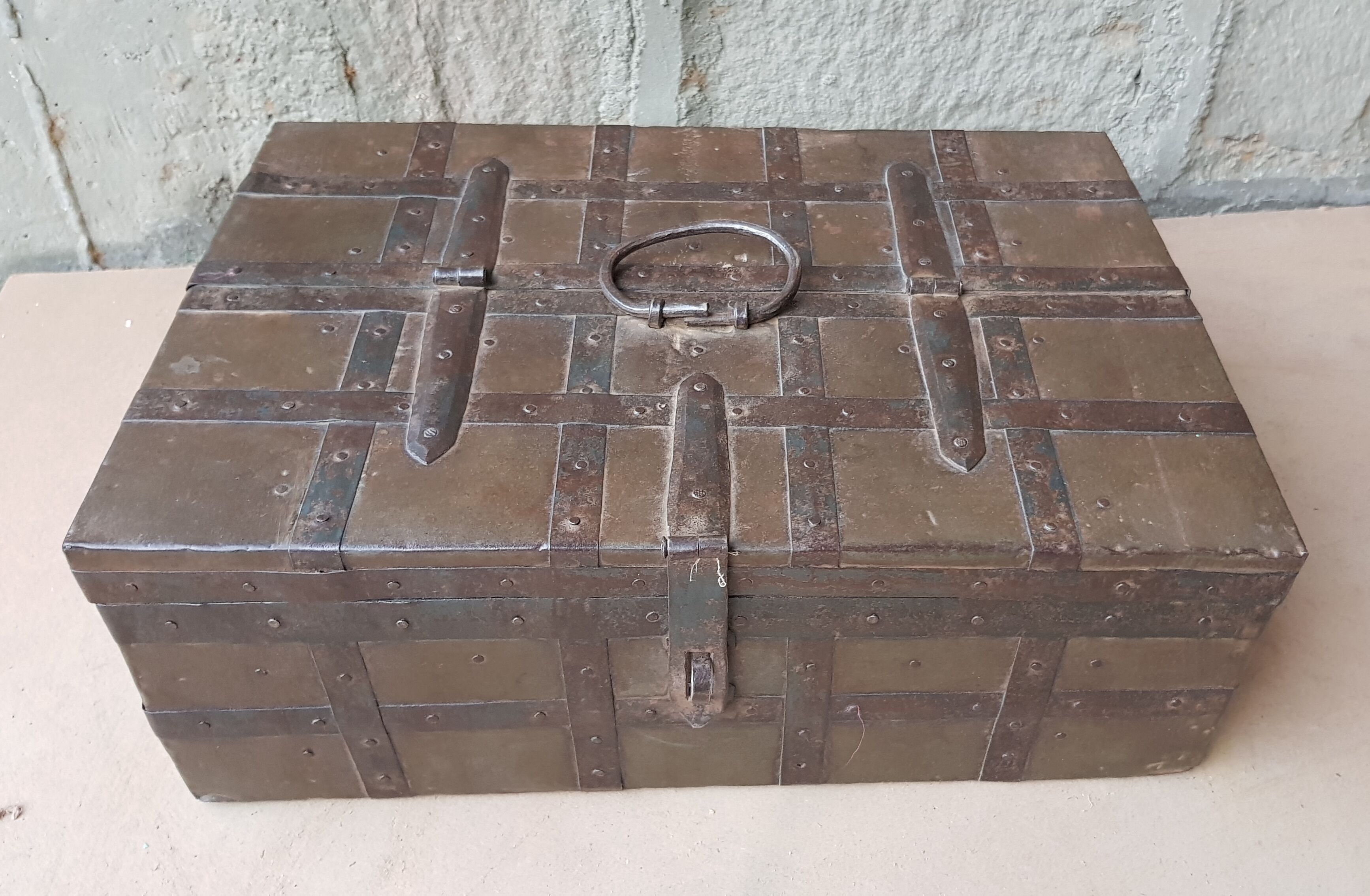 Old tribal chest in hammered metal