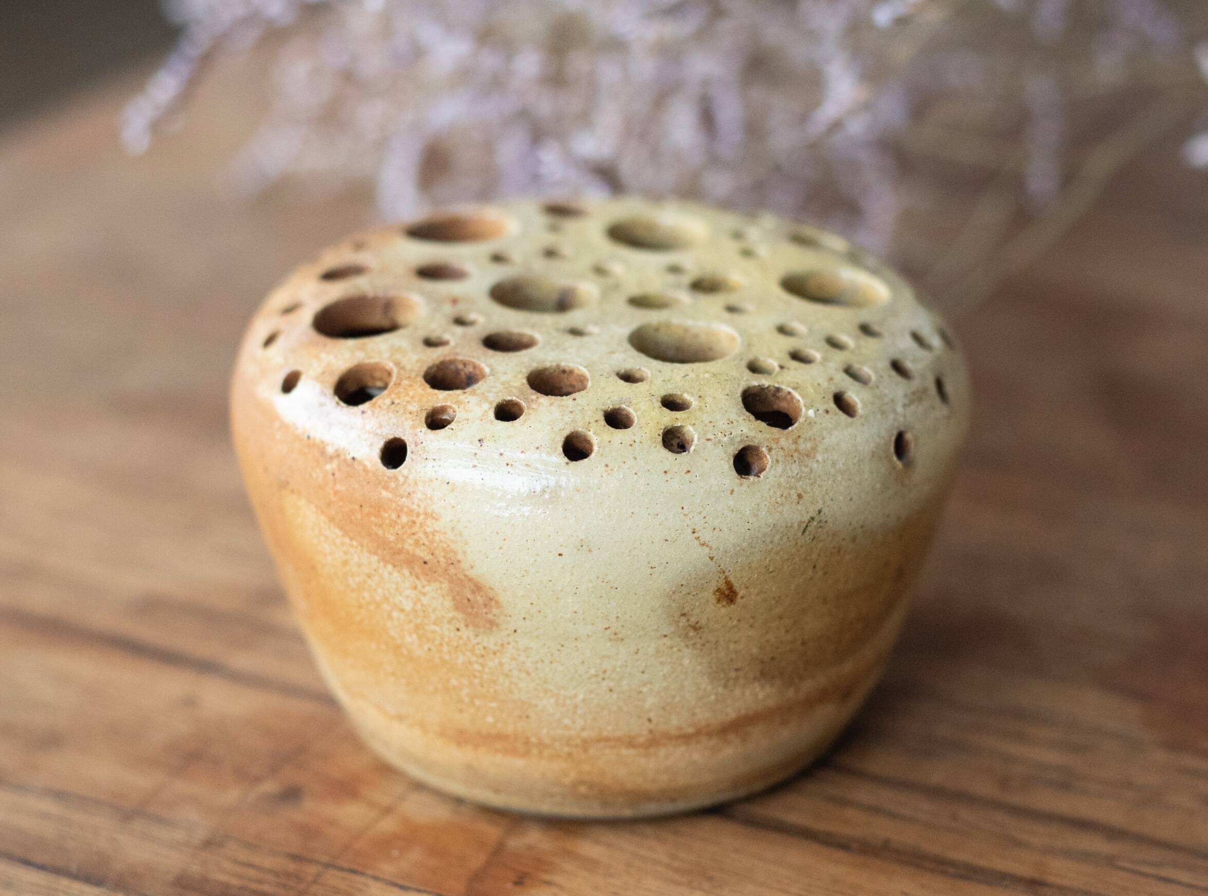 Signed sandstone flower pick