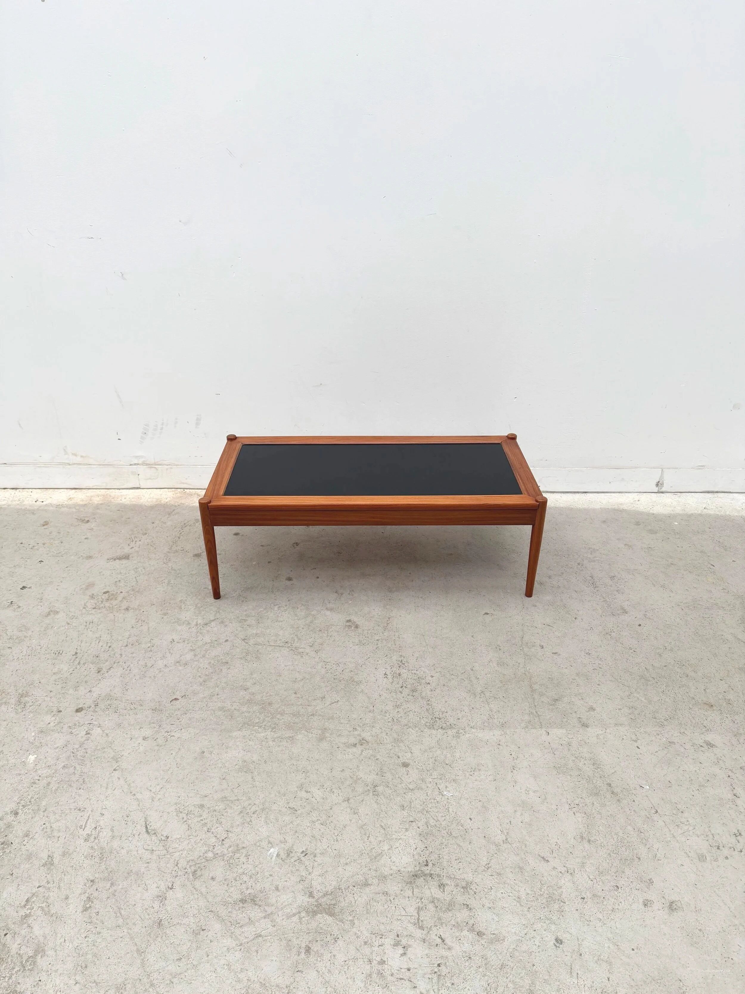 Scandinavian coffee table in teak and black formica, 1960.
