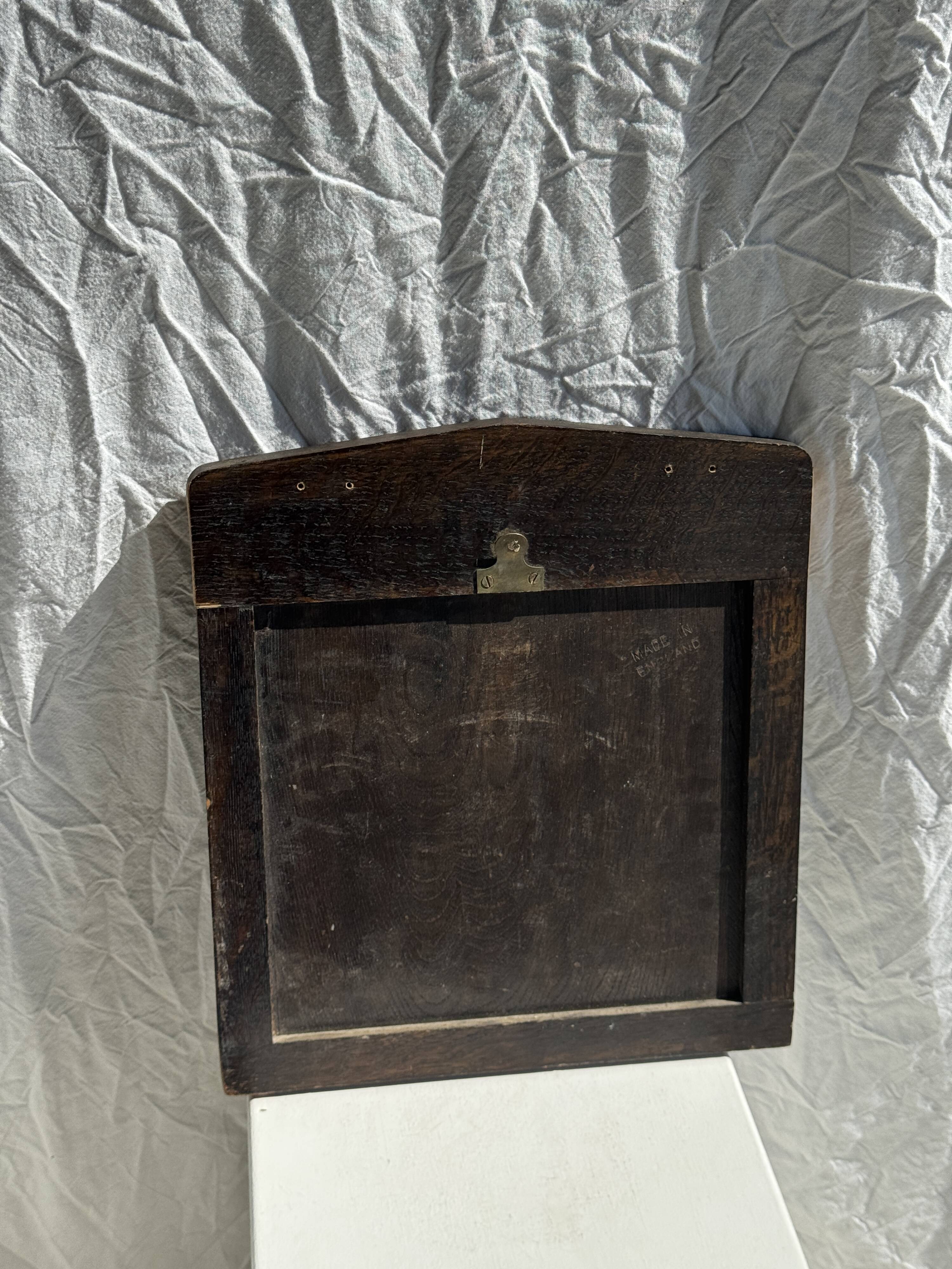 Small antique English rectangular mirror with pediment and oak frame