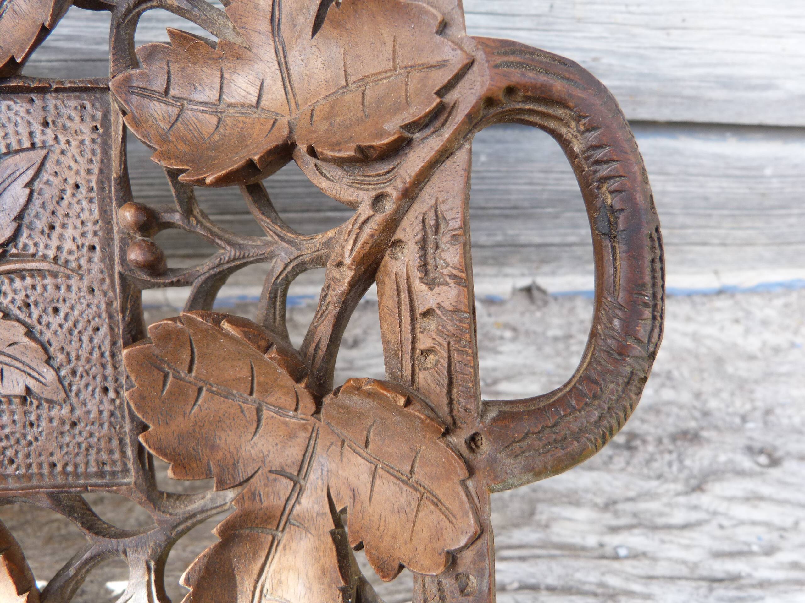 Small wooden tray cut out with leaf patterns