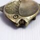 Vintage fish-shaped brass pocket emptier