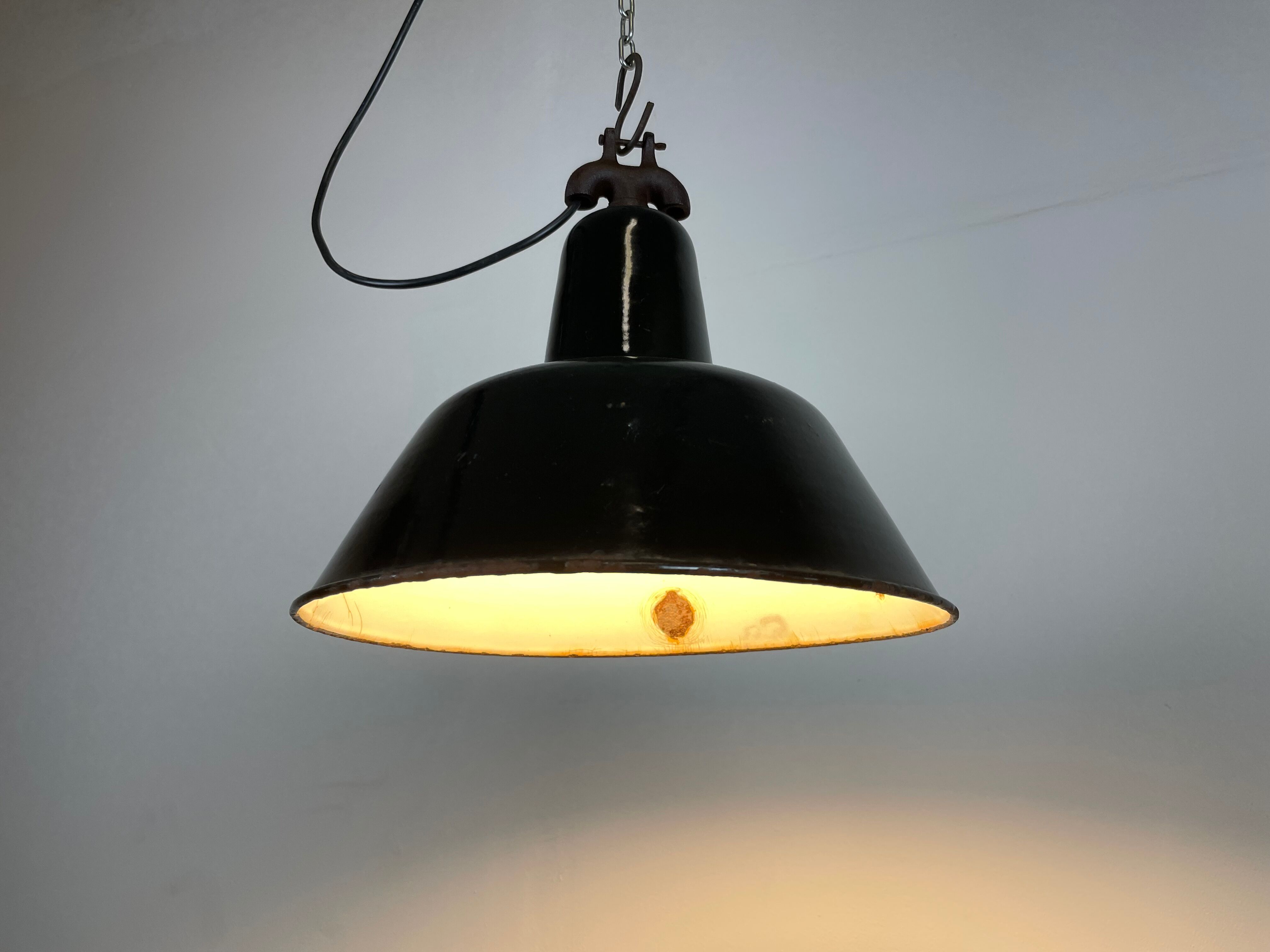 Industrial black enamel factory lamp with cast iron top, 1950s