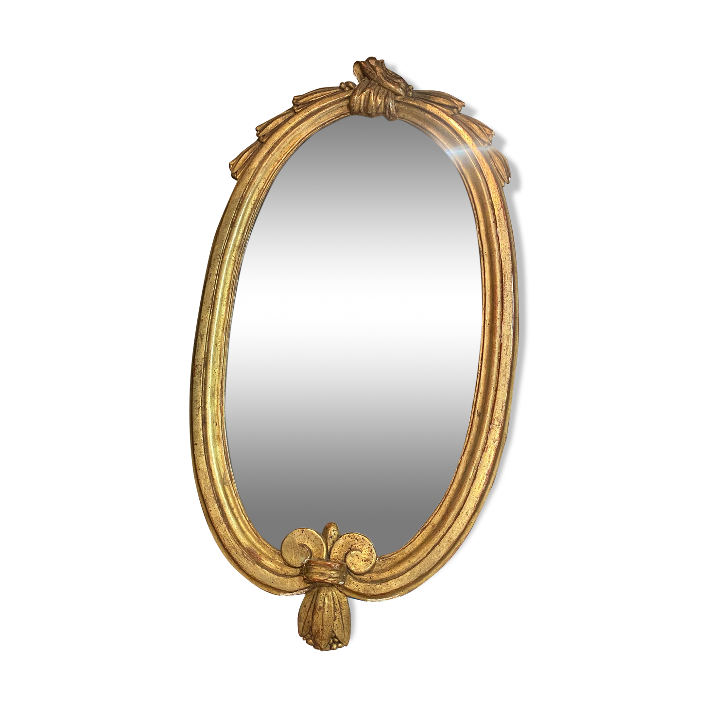 Miroir oval en bois doré