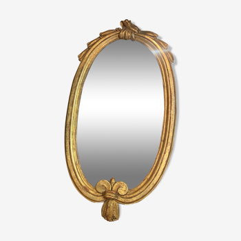 Miroir oval en bois doré