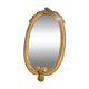 Oval mirror in gilded wood