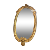 Oval mirror in gilded wood