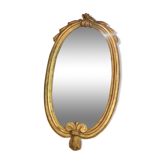 Miroir oval en bois doré