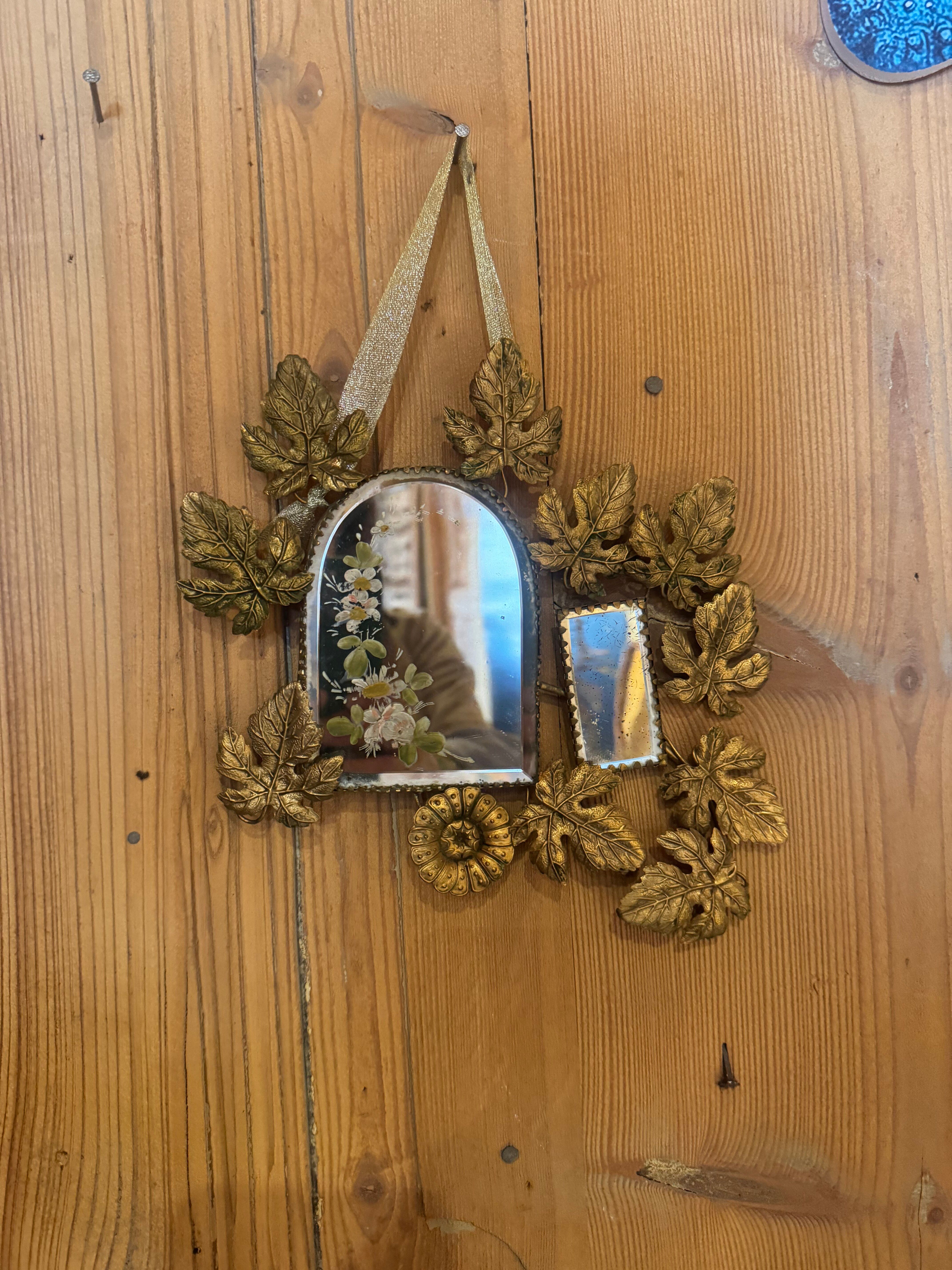 Ornamental brass mirror