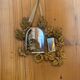 Ornamental brass mirror