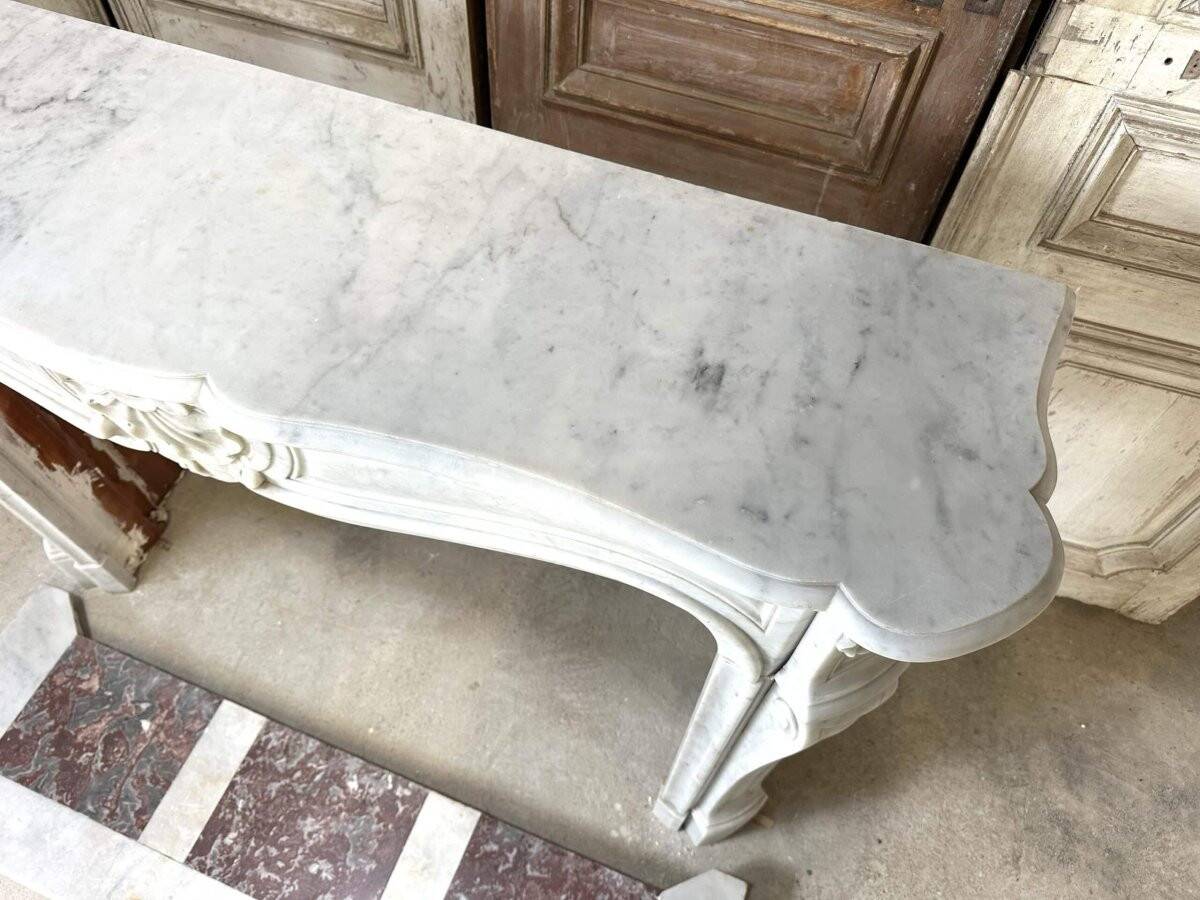 Large white marble fireplace in Louis XV style, 19th century.