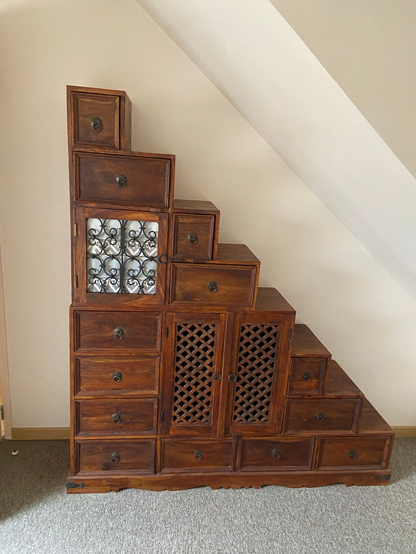 Indonesian staircase furniture in rosewood and wrought iron.