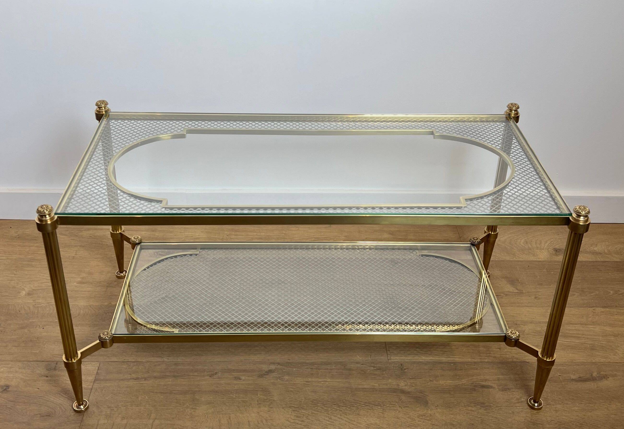 Rare bronze, brass, and steel mesh coffee table with a double glass top resting on a brass mesh. French work by Jansen