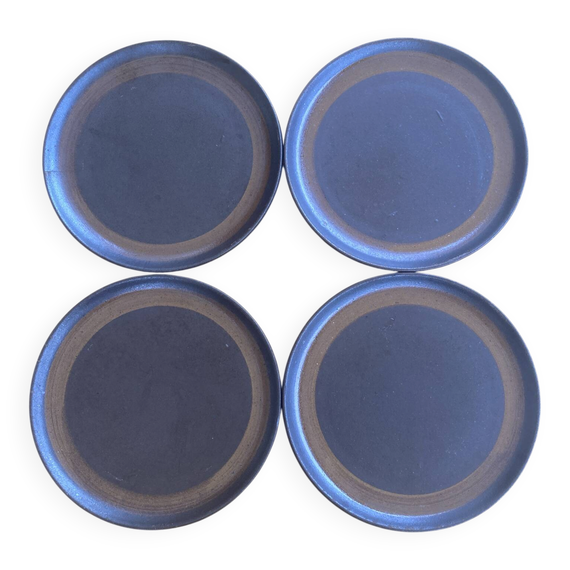 Deep plates made of organic, wild, earthy marsh clay.