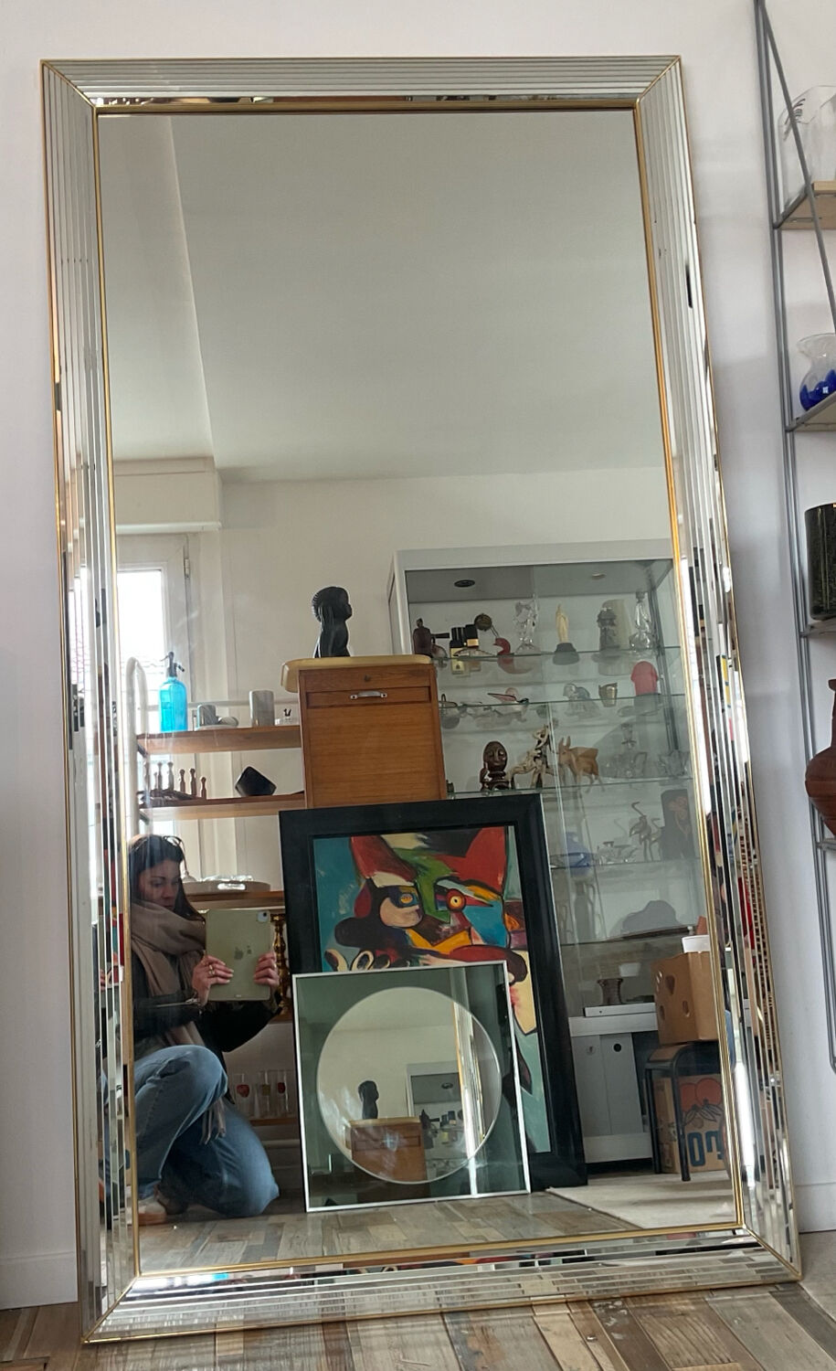 Large vintage Hollywood Regency style mirror with shutters.