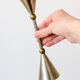 Pair of postmodern candlesticks in Memphis style made of steel and brass.