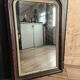 Louis-Philippe mirror in old wood and patinated gilded surround