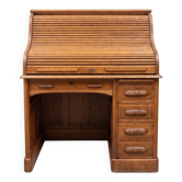 Oak desk with sliding door and leather wood chair.