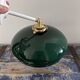 Tilting wall light in green opaline
