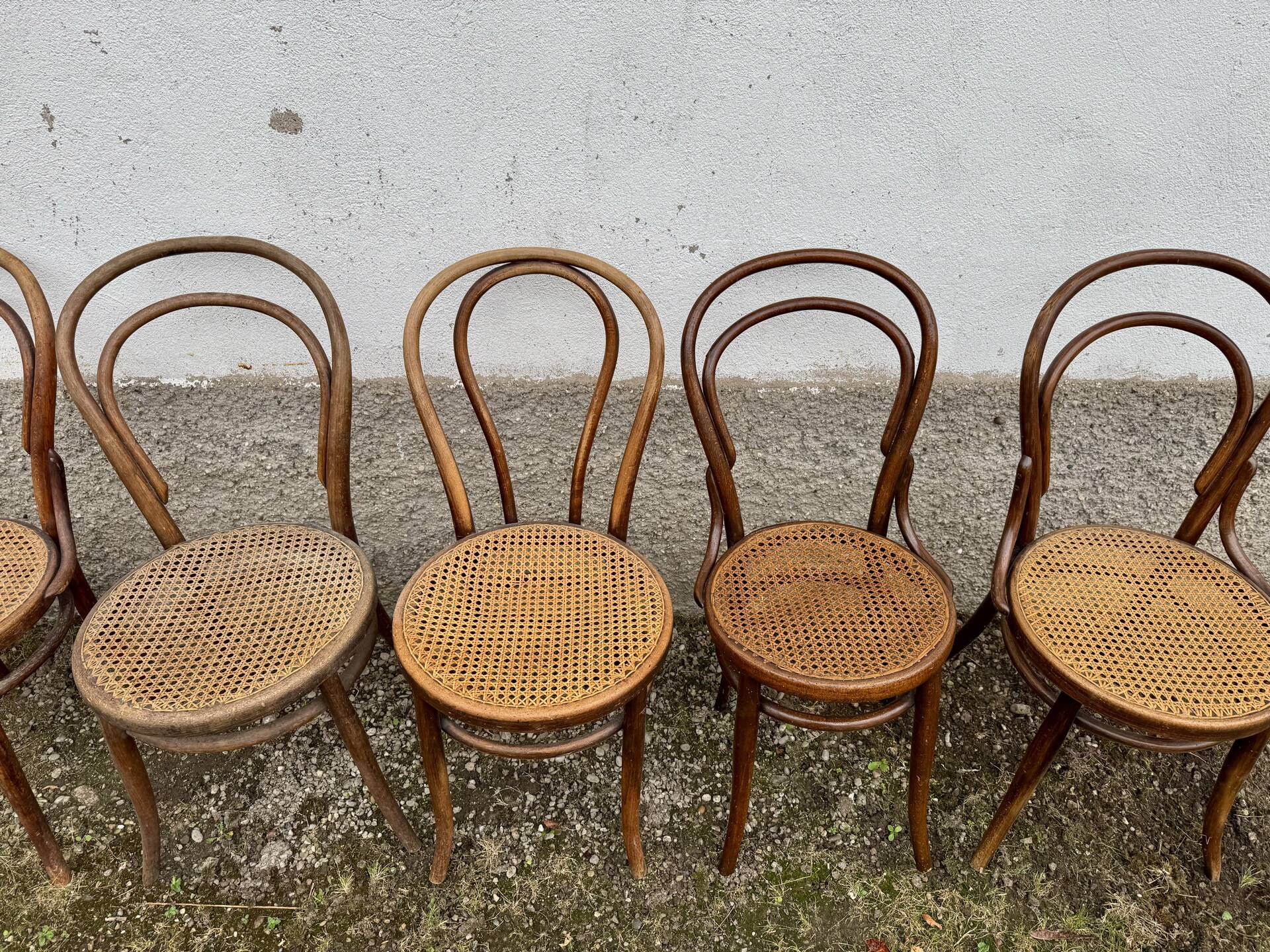 Set of 10 bentwood bistro chairs with cane seat.