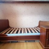 Bed with cherry wood base and bedside table