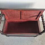 Natural wood chest forming a bench, ringed shoulders