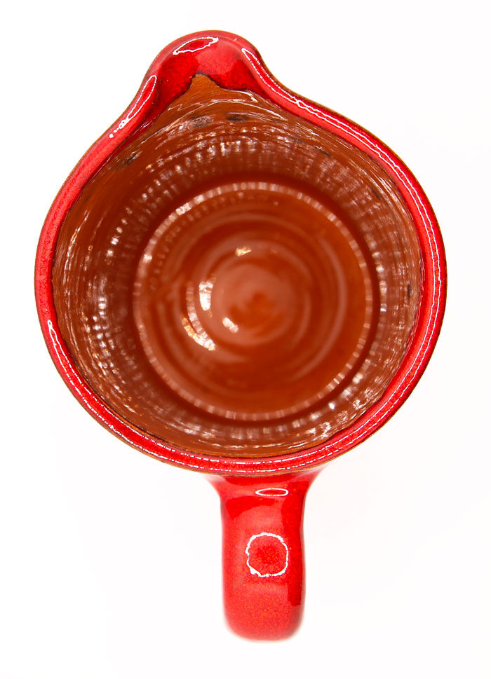 Bright red ceramic pitcher