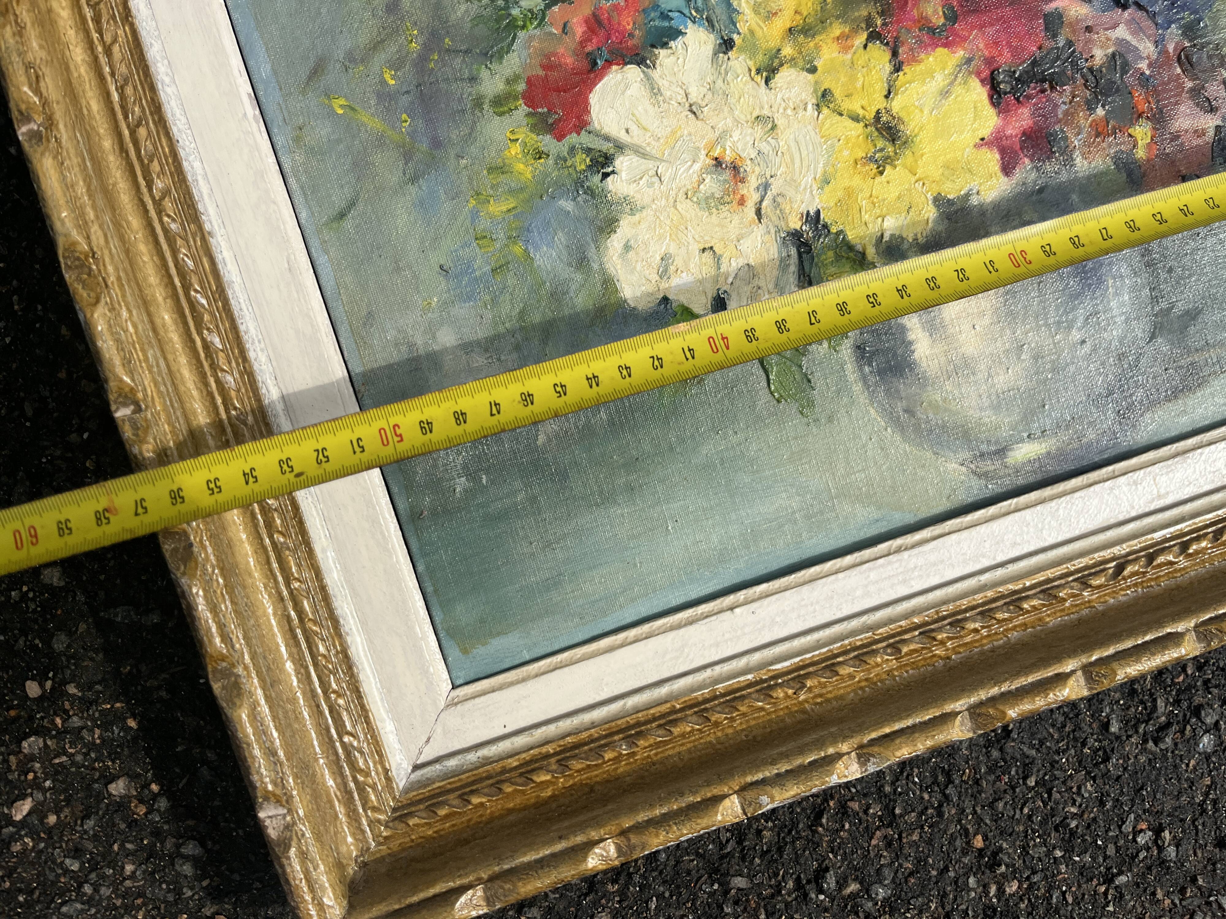 Still life of flowers in Impressionist style with a golden frame.