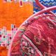 Restored vintage 70s armchair with custom-made Moroccan cushions, pink and red armchair